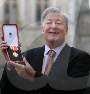 Sir Stephen Fry knighted
