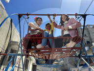 Gaza children playing amidst tents and rubble