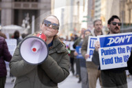 Demonstrators Protest Mass Firings Of Federal Employees By DOGE