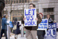 Demonstrators Protest Mass Firings Of Federal Employees By DOGE