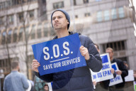 Demonstrators Protest Mass Firings Of Federal Employees By DOGE