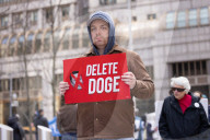Demonstrators Protest Mass Firings Of Federal Employees By DOGE