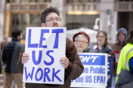 Demonstrators Protest Mass Firings Of Federal Employees By DOGE