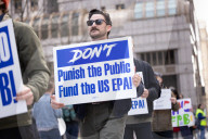 Demonstrators Protest Mass Firings Of Federal Employees By DOGE