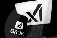 Logos Of Large Companies On Laptop