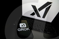 Logos Of Large Companies On Laptop
