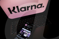 Logos Of Large Companies On Laptop