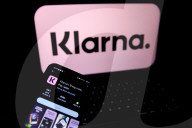 Logos Of Large Companies On Laptop
