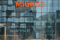 Migros Logo On A Glass Facade