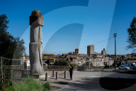 A Lonesome Moai Stands In A Small Italian Town Some 9,000 Miles Away From Its Easter Island Brethren.