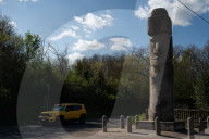 A Lonesome Moai Stands In A Small Italian Town Some 9,000 Miles Away From Its Easter Island Brethren.