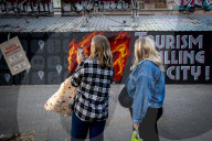  Anti-Tourism Graffiti In Barcelona Draws Tourists Despite Local Discontent