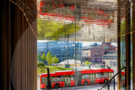 Bus Passes The VIA Building In Oslo
