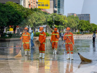 Sanitation Workers Sweep Streets In Ho Chi Minh City