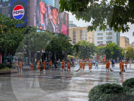Sanitation Workers Sweep Streets In Ho Chi Minh City