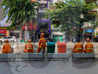 Sanitation Workers Sweep Streets In Ho Chi Minh City