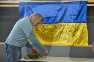 Ukrainian volunteers weave camouflage nets for soldiers