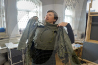 Ukrainian volunteers weave camouflage nets for soldiers