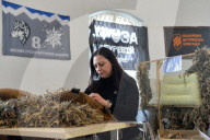 Ukrainian volunteers weave camouflage nets for soldiers