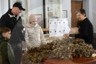 Ukrainian volunteers weave camouflage nets for soldiers