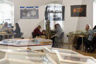 Ukrainian volunteers weave camouflage nets for soldiers