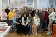 Ukrainian volunteers weave camouflage nets for soldiers