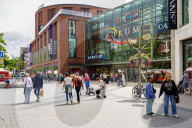 Shoppers Outside A German Mall