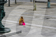 Woman With Smartphone In City Square