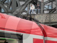 Youth Sitting On Hackerbrücke Above S-Bahn Train