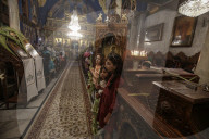 Palestinian Christians attend a Palm Sunday mass at the Greek Orthodox Saint Porphyrius Church, in Gaza CityGaza Christians observe Palm Sunday