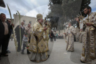 Palestinian Christians attend a Palm Sunday mass at the Greek Orthodox Saint Porphyrius Church, in Gaza CityGaza Christians observe Palm Sunday