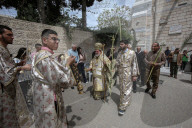 Palestinian Christians attend a Palm Sunday mass at the Greek Orthodox Saint Porphyrius Church, in Gaza CityGaza Christians observe Palm Sunday