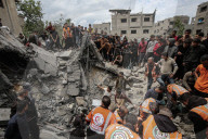 Gaza defense teams rescue victims of Israeli bombing