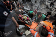 Gaza defense teams rescue victims of Israeli bombing
