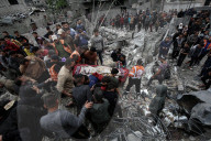 Gaza defense teams rescue victims of Israeli bombing