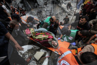 Gaza defense teams rescue victims of Israeli bombing