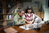 Chess playing robot makes its own moves