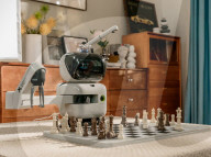 Chess playing robot makes its own moves