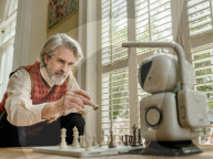 Chess playing robot makes its own moves