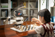 Chess playing robot makes its own moves