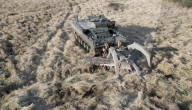 Military plough clears mines and makes dirt roads
