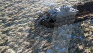 Military plough clears mines and makes dirt roads