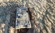 Military plough clears mines and makes dirt roads