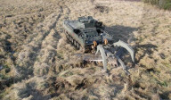 Military plough clears mines and makes dirt roads