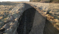 Military plough clears mines and makes dirt roads
