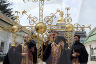 Blessing of cross at Trinity Gate Church in Kyiv