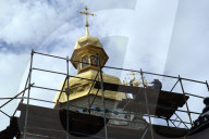 Blessing of cross at Trinity Gate Church in Kyiv