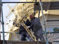 Blessing of cross at Trinity Gate Church in Kyiv