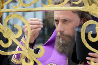 Blessing of cross at Trinity Gate Church in Kyiv