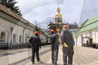 Blessing of cross at Trinity Gate Church in Kyiv
